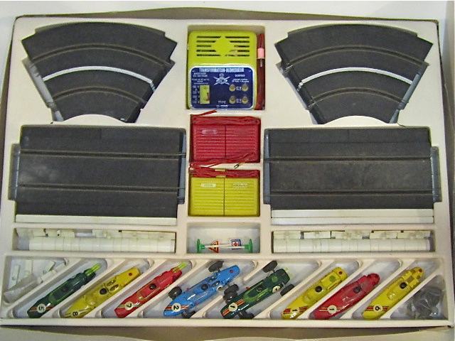 CONTENTS OF THE 1963 SET. 2 COMPLETE CARS & 6 EXTRA BODIES. 1/32ND SCALE.