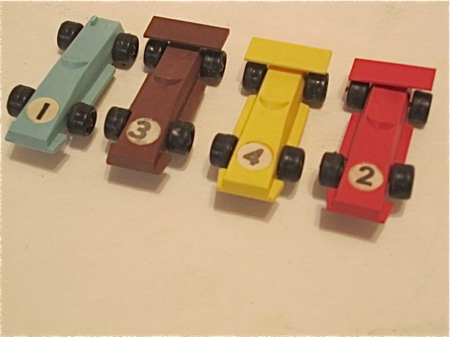 ALL 4 CARS. 1 IS MISSING ITS REAR WING