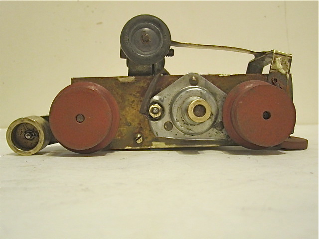LEFT SIDE OF THE MOTORIZED CHASSIS WITH 2 WOOD WHEELS FOR BELT DRIVE 