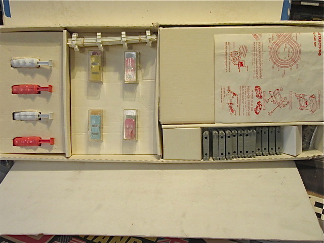 CONTENTS OF THE HO SCALE 4 LANE SET. RARE 