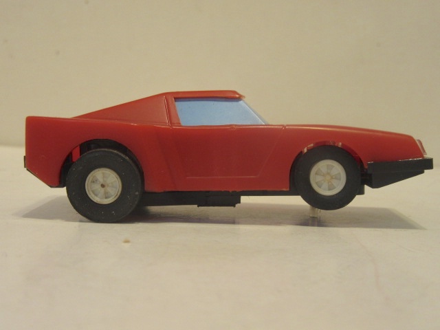 SIDE VIEW OF 1 OF THE 1/43RD SCALE SLOT CARS