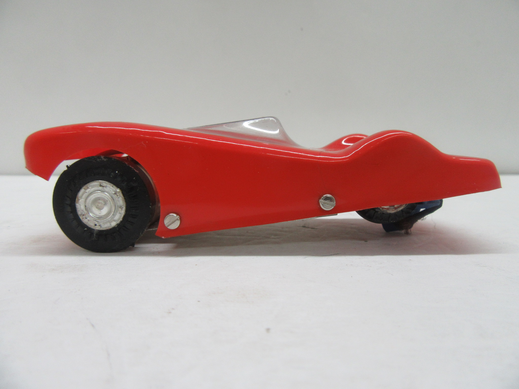 SIDE VIEW OF THE 1/36TH SCALE DIRECT DRIVE RED THINGIE. VERY RARE