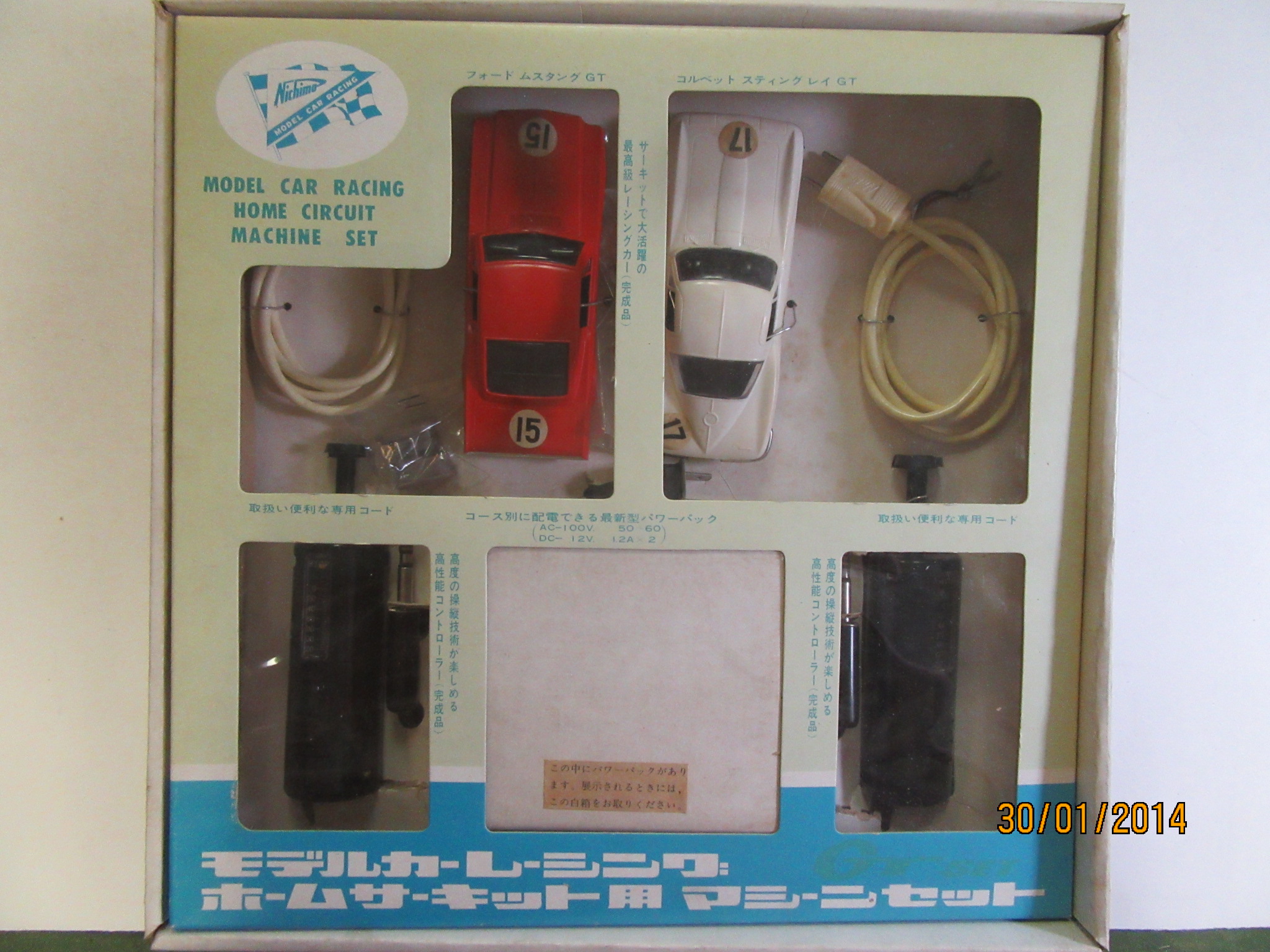 CONTENTS OF THE 1/32ND SCALE SET THAT CAME WITH A FORD MUSTANG FASTBACK, A CORVETTE STINGRAY, A TRANSFORMER, 2 CONTROLLERS BUT NO TRACK WHICH YOU HAD TO BUY SEPARATELY. MIB RARE