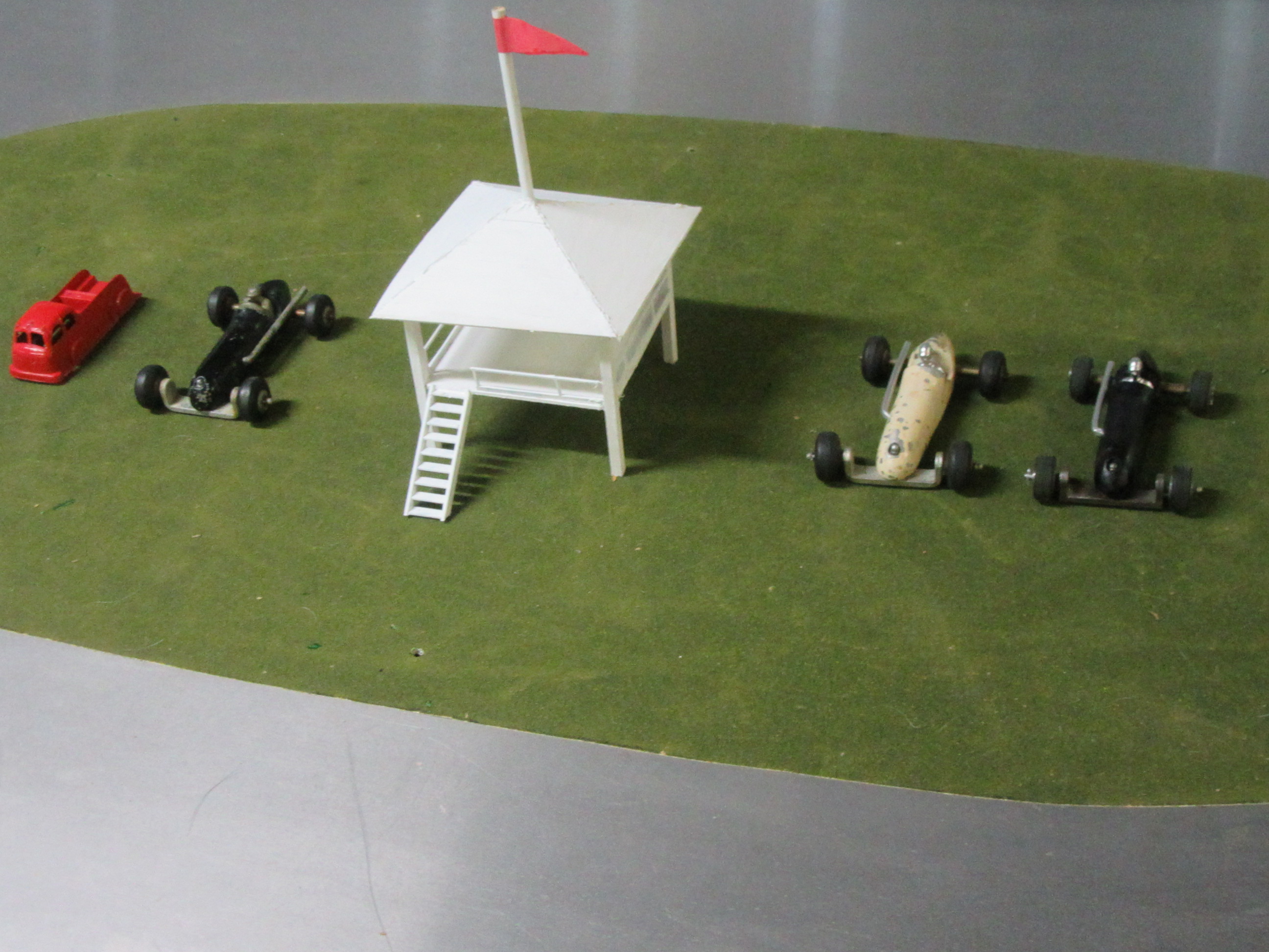 ALL 3 CARS PLUS THE WOODEN JUDGES STAND