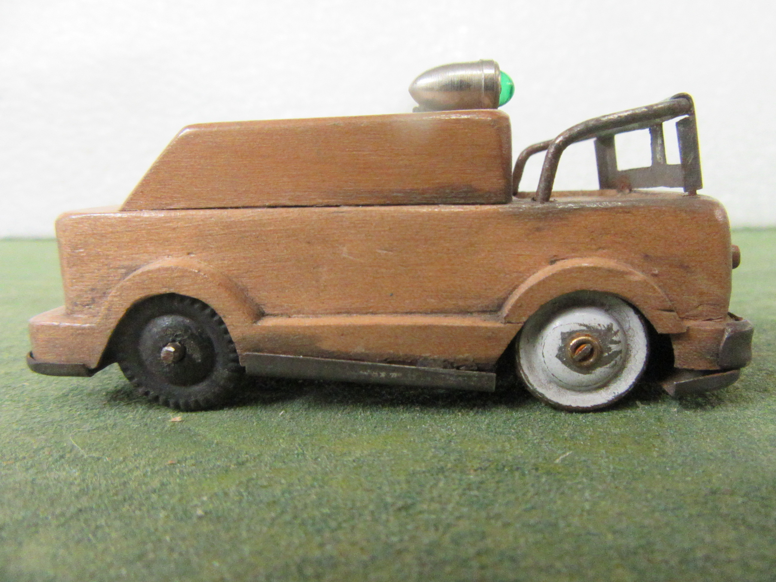SIDE VIEW OF THE WOOD BODIED 1/43RD SCALE FIRETRUCK