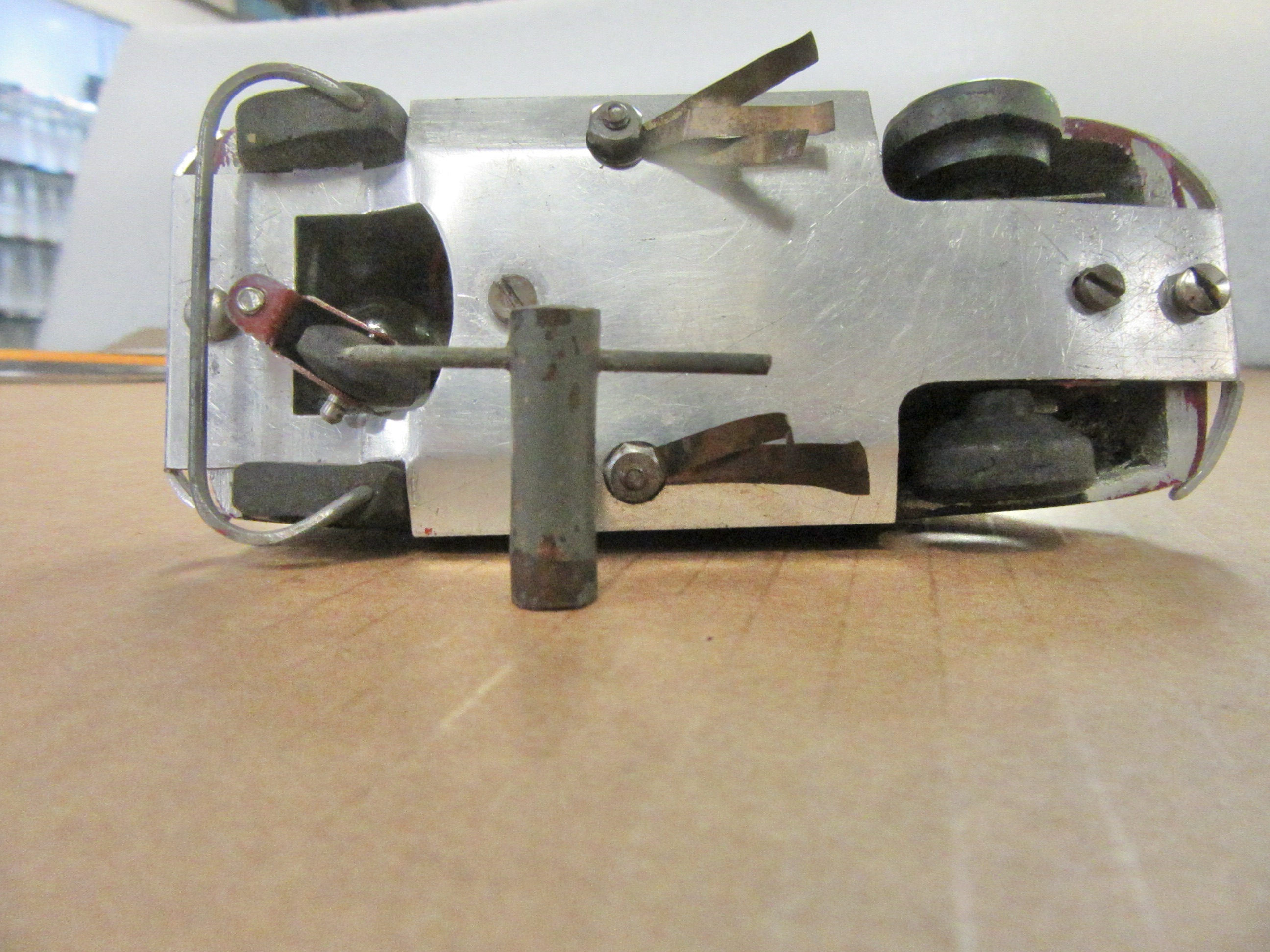 BOTTOM OF THE FIAT WITH A SMALL WRENCH FOR THE NUTS.