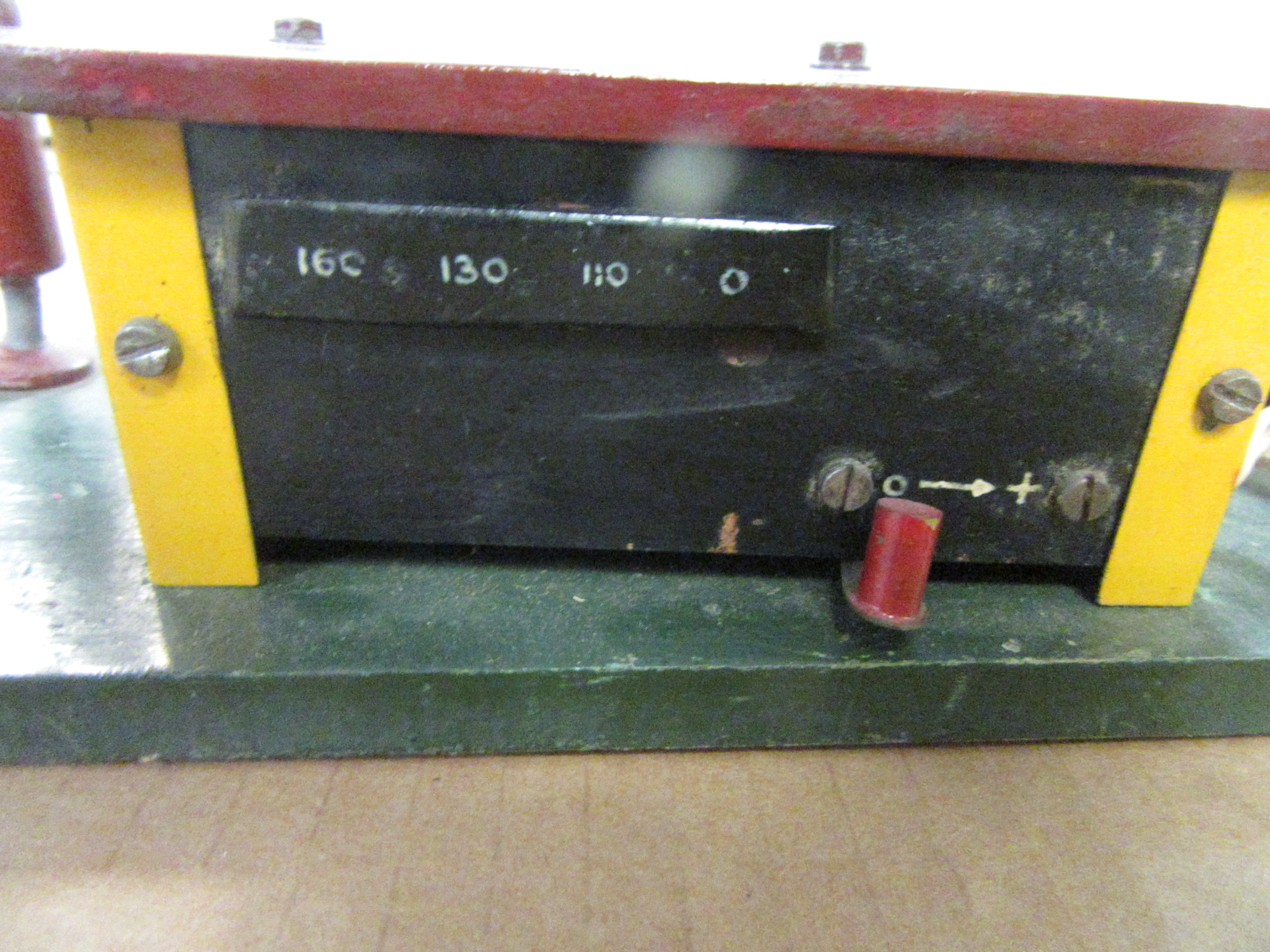 SPEED CONTROL LOCATED ON THE BACK WALL OF THE GAS STATION.