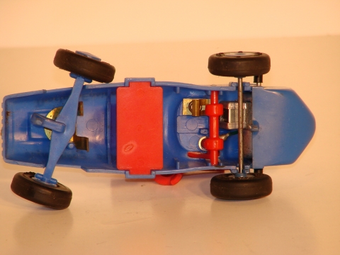 UNDERSIDE OF THE 1/32ND SCALE INDY CAR SHOWING WHERE THE 2 BATTERYS FIT