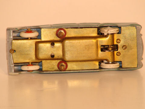 UNDERSIDE OF THE 1/43RD SCALE SIMCA VERSAILLES, 2N VERSION WITH BUTTON CONTACTS INSTEAD OF WIRE.