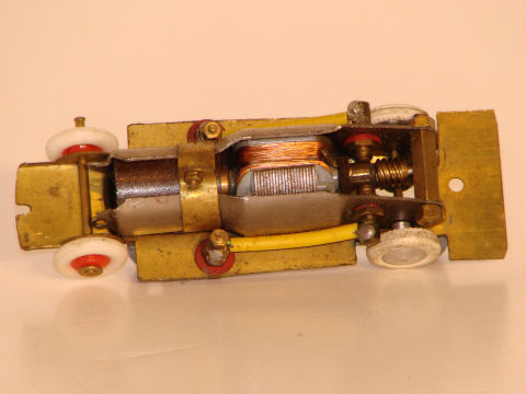 MOTOR OF THE 1/43RD SCALE ZAMAC SIMCA VERSAILLES, SHOWING THE WORM GEAR & BRASS CHASSIS,MADE IN 1958.