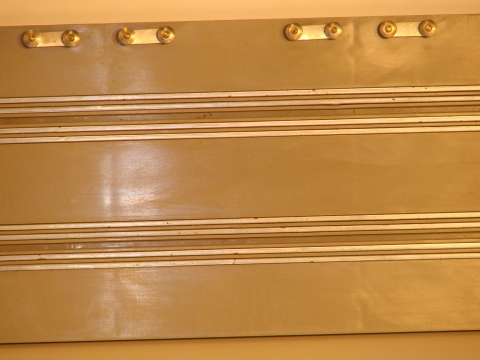 TRACK SHOWING THE 4 STRIPS AROUND EACH SLOT.THIS ALLOWED UP TO 3 CARS TO BE RACED IN EACH LANE