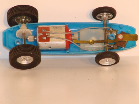 INSIDE THE 1/43RD SCALE F1 CAR SHOWING THE MOTOR NOISE DEVICE.