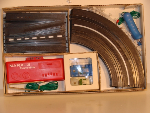 CONTENTS OF THE 1/43RD SCALE CHAPARRAL 2F SET, MADE IN HONG KONG BY SPEEDKING FOR SPEEDMARX