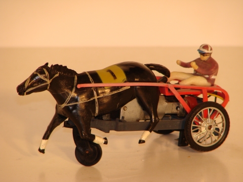 SULKY. THE FRONT WHEEL WHICH GOES IN THE SLOT IS FLAT ON 1 SIDE CAUSING THE HORSE TO MOVE UP & DOWN..